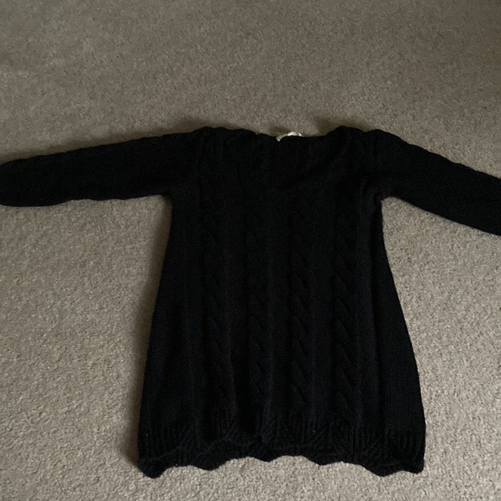 Long  navy knit sweater; could be a sweater dress.